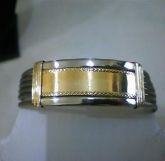 BRACELETE EM AÇO COM APLIQUE DE OURO